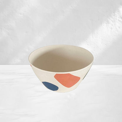 white bowl for dining room table painted with an abstract ball design in blue and orange by maoma art 
