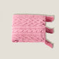 Rózsaszín kötött takaró