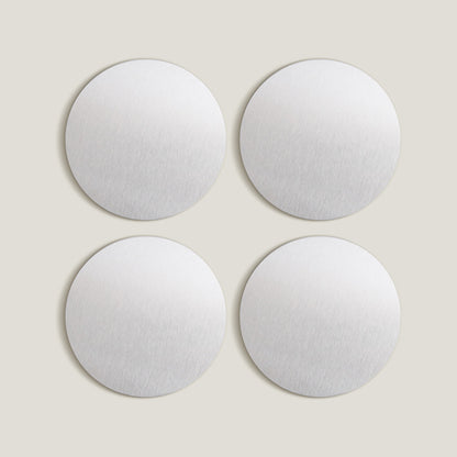 Juego de posavasos de acero inoxidable plateados con puntos
